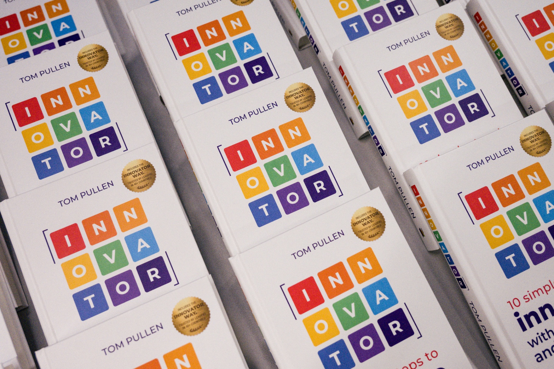 Stacks of INNOVATOR books on display